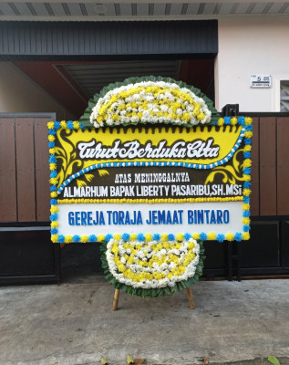 Papan Bunga Duka di Teluk Mengkudu